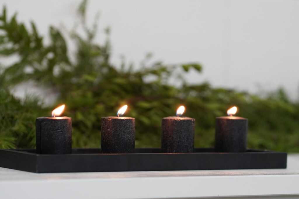 black candles with white background