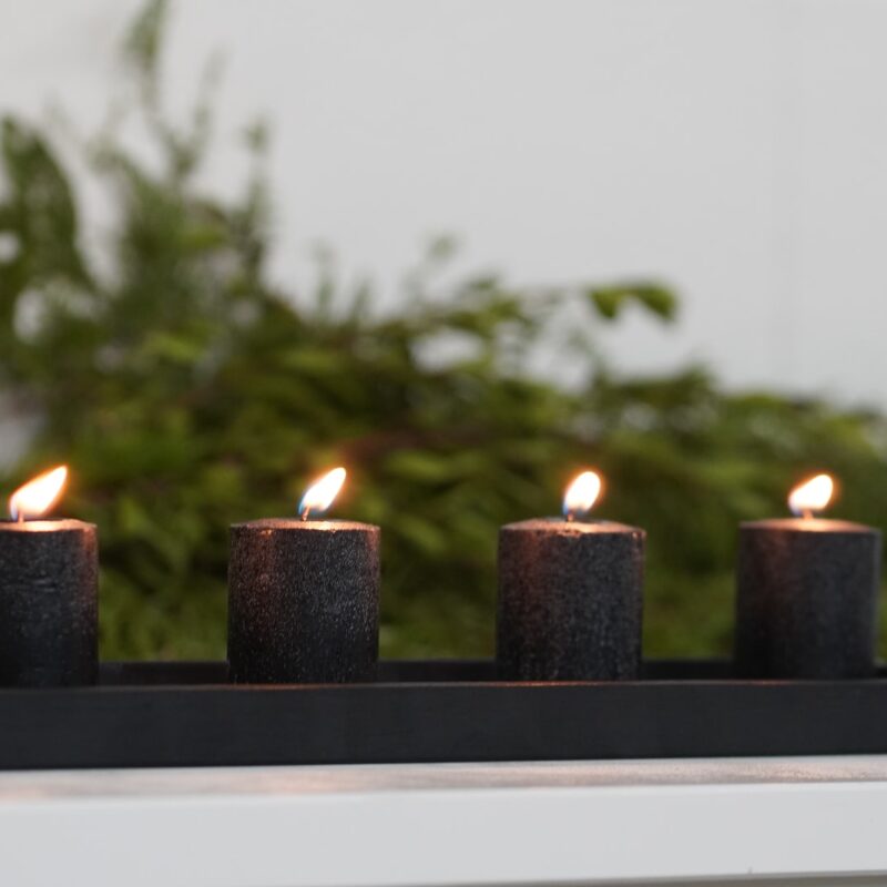 black candles with white background