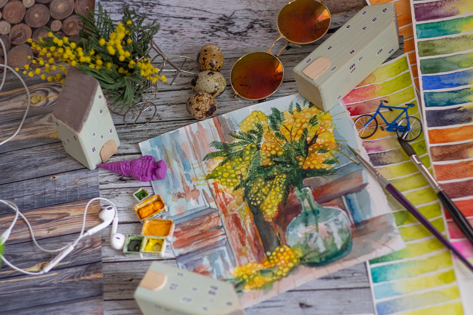 yellow flowers on brown wooden table